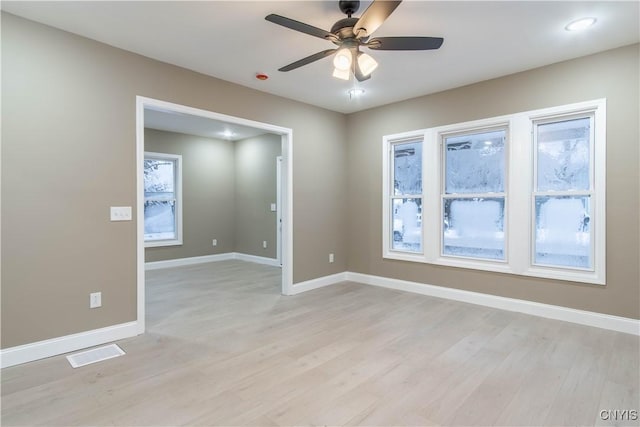 unfurnished room featuring ceiling fan and light wood-type flooring