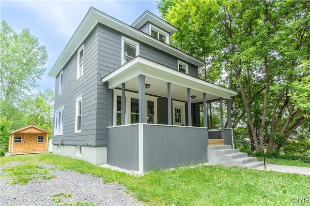 223 S Washington St, Wilna, NY 13619 - traditional style home with a porch and a storage shed