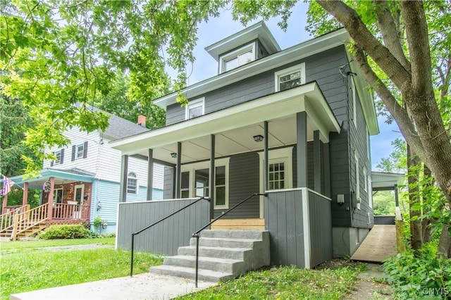 223 S Washington St, Wilna, NY 13619 - traditional style home featuring a porch, stairway, and a front yard