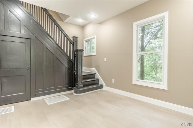 223 S Washington St, Wilna, NY 13619 - entrance foyer featuring plenty of natural light, wood finished floors, stairway, and recessed lighting