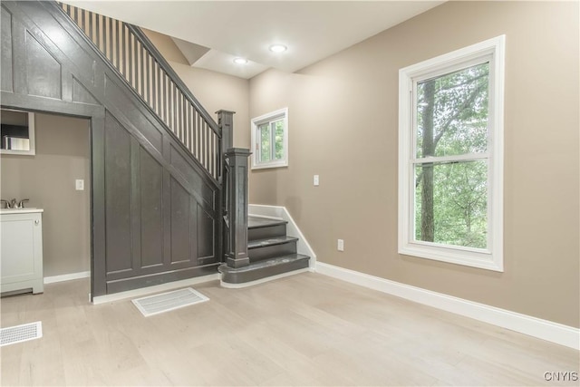 223 S Washington St, Wilna, NY 13619 - stairway with wood finished floors and recessed lighting