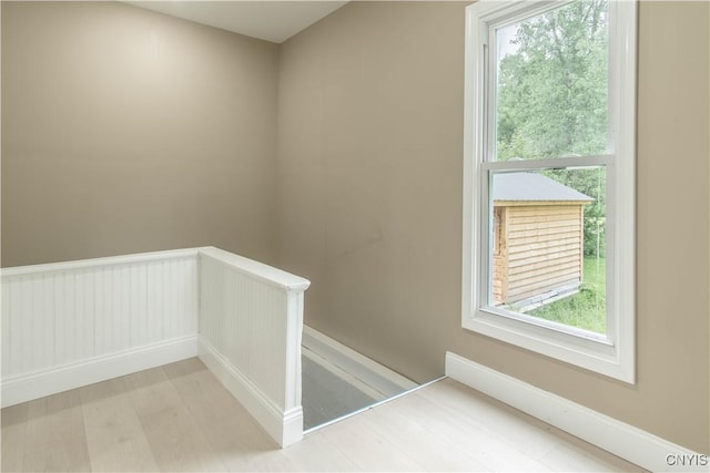 223 S Washington St, Wilna, NY 13619 - staircase featuring plenty of natural light and wood finished floors