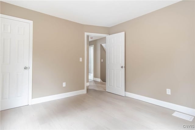 223 S Washington St, Wilna, NY 13619 - unfurnished bedroom featuring light wood-type flooring and baseboards