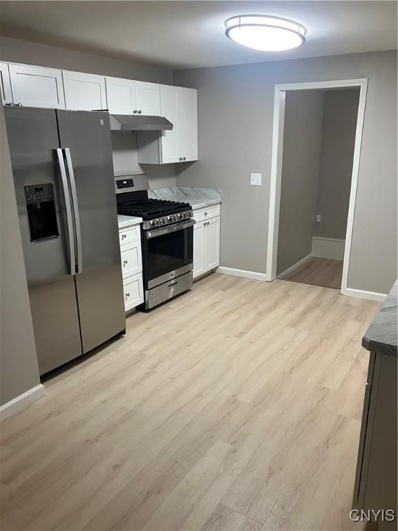 kitchen featuring light wood-type flooring, white cabinetry, and stainless steel appliances