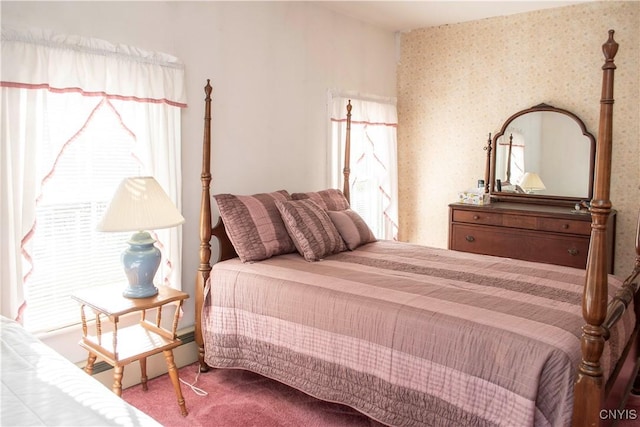 bedroom with carpet flooring and multiple windows