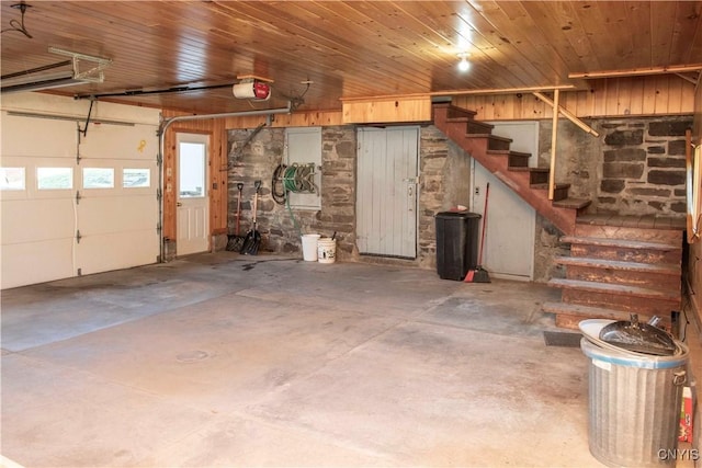 garage with wooden ceiling and a garage door opener