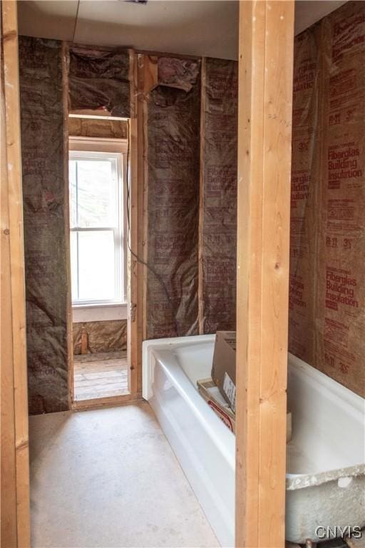 bathroom featuring a washtub