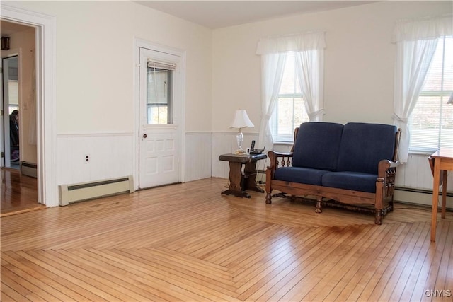 living area featuring light hardwood / wood-style flooring and a baseboard radiator