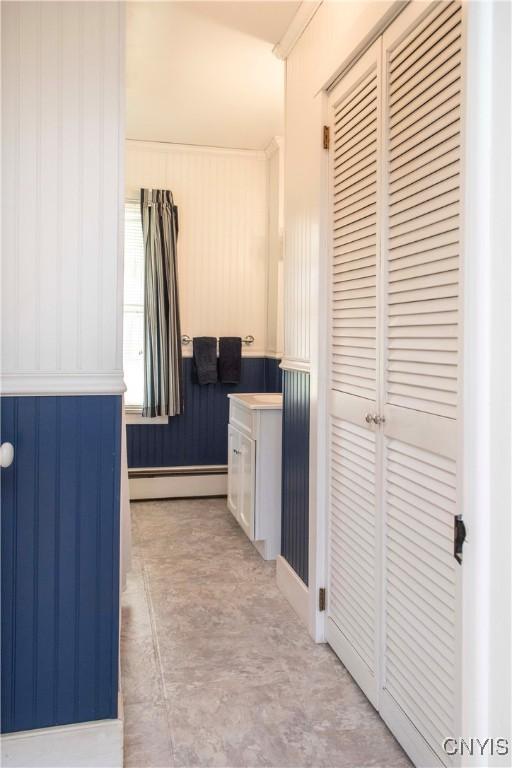 bathroom featuring concrete flooring and baseboard heating