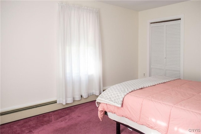 carpeted bedroom featuring a closet and a baseboard radiator