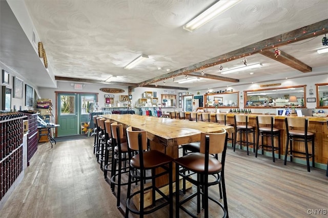 dining room with wood-type flooring and french doors