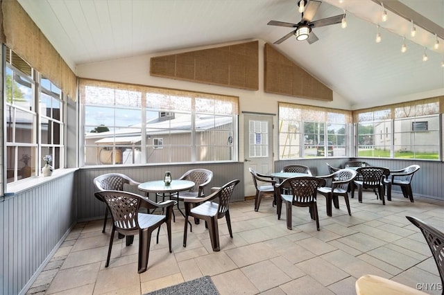 sunroom / solarium with ceiling fan and vaulted ceiling