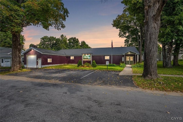 ranch-style house with an outbuilding and a garage