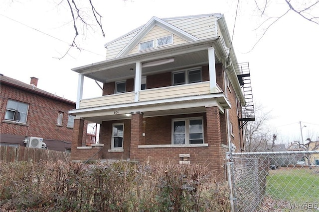 view of front of property with ac unit and a porch