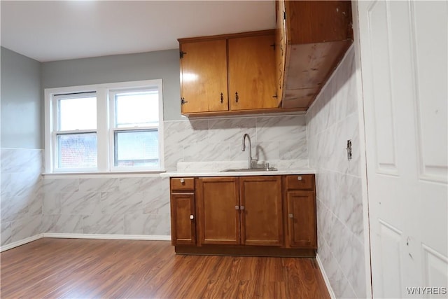 kitchen featuring sink and hardwood / wood-style flooring