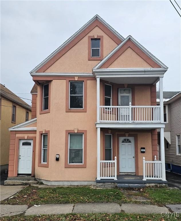 view of front of home with a balcony