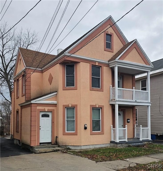 view of front of home with a balcony