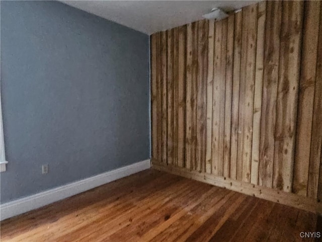 spare room featuring hardwood / wood-style flooring