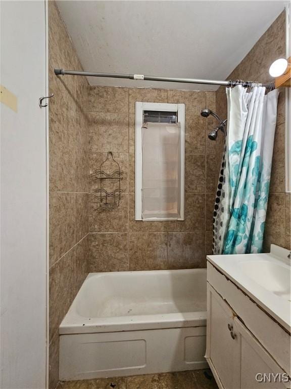 bathroom with vanity and shower / bath combination with curtain