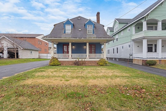 view of front of home with a front lawn and covered porch