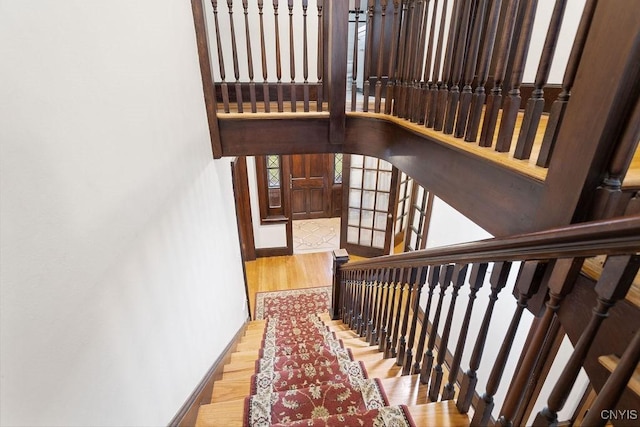 stairs featuring wood-type flooring