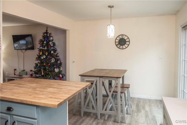 dining space with light wood-type flooring