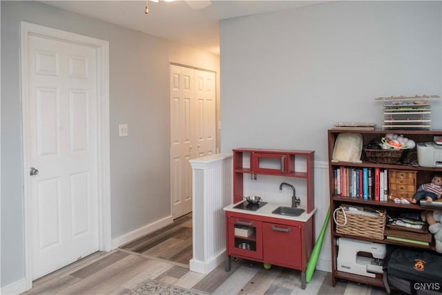 interior space featuring hardwood / wood-style floors and sink