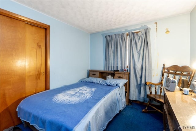 carpeted bedroom with a closet