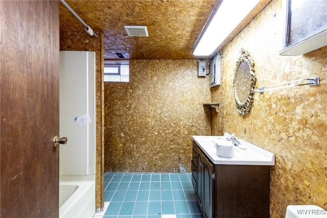 bathroom featuring tile patterned flooring, vanity, and shower / bathtub combination