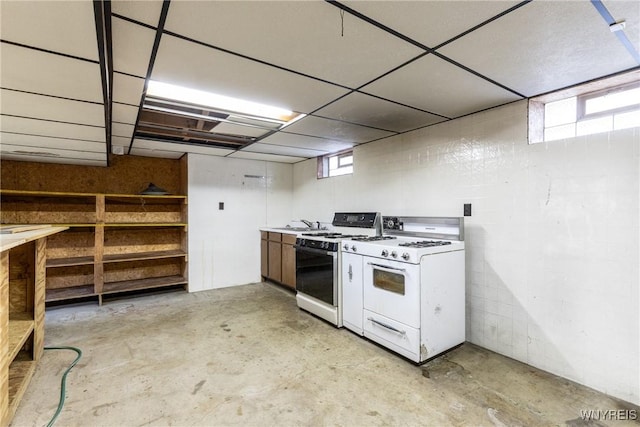 kitchen featuring white range with gas cooktop