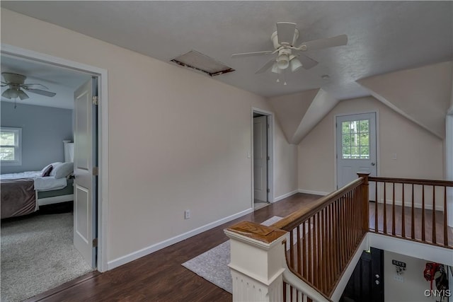 interior space with dark hardwood / wood-style flooring and vaulted ceiling