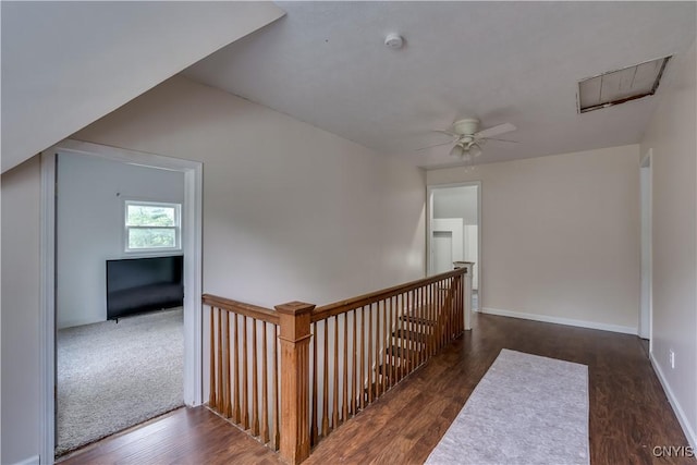 hall with dark hardwood / wood-style flooring