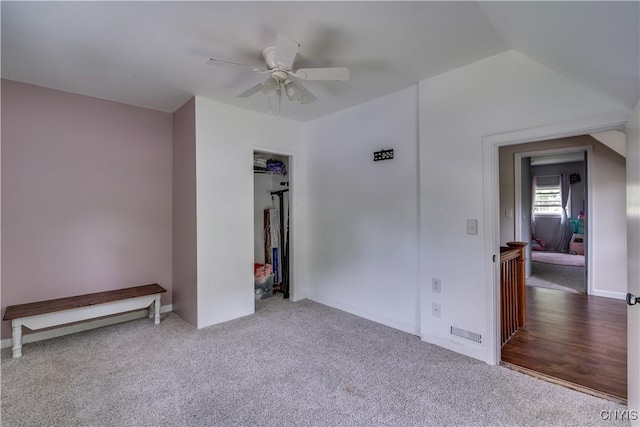 unfurnished bedroom with carpet flooring and ceiling fan