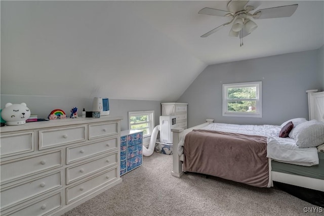 bedroom with ceiling fan, lofted ceiling, light carpet, and multiple windows