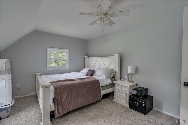 bedroom with light carpet, vaulted ceiling, and ceiling fan