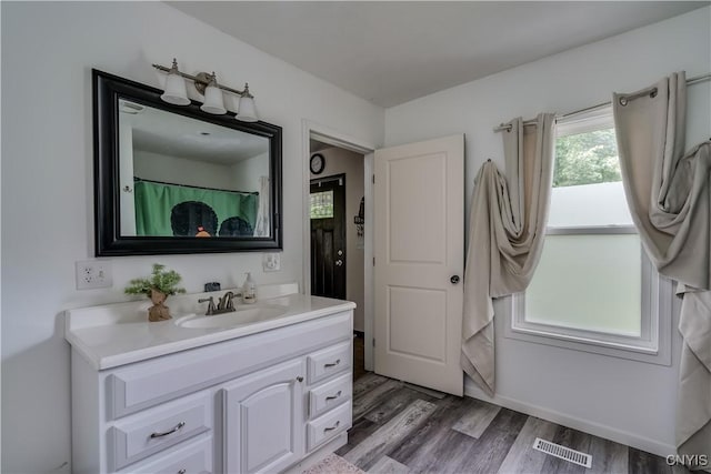 bathroom featuring vanity and wood-type flooring