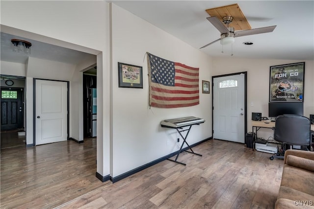 entrance foyer featuring ceiling fan, lofted ceiling, and hardwood / wood-style flooring