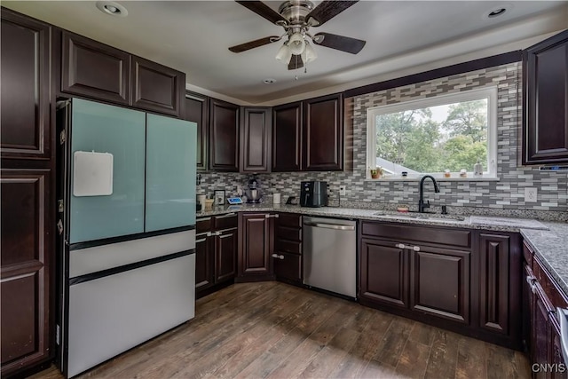 kitchen featuring sink, white fridge, stainless steel dishwasher, and dark hardwood / wood-style floors