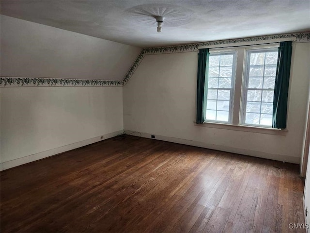 bonus room featuring hardwood / wood-style flooring and lofted ceiling