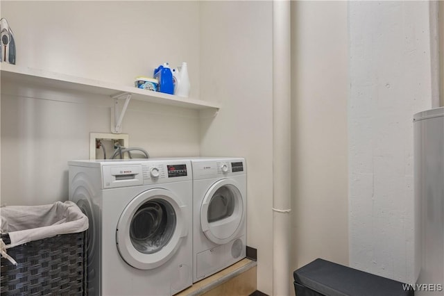 laundry area featuring washing machine and clothes dryer