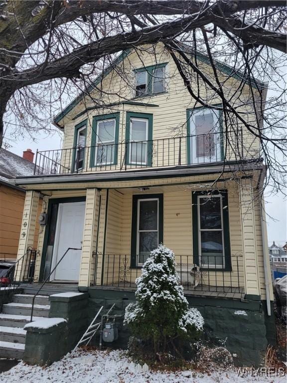 view of front of home with a balcony