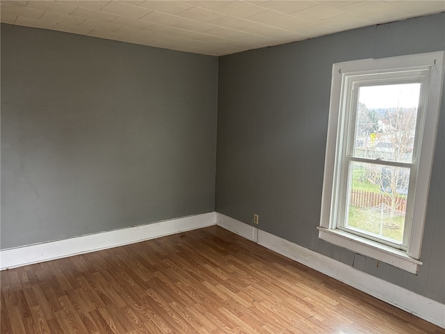 spare room featuring hardwood / wood-style flooring