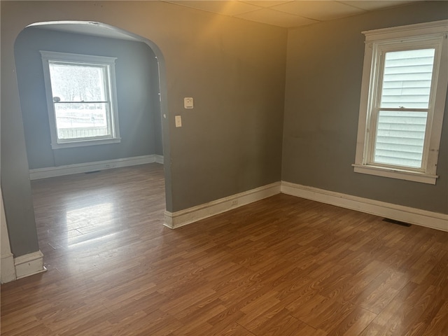 spare room featuring wood-type flooring