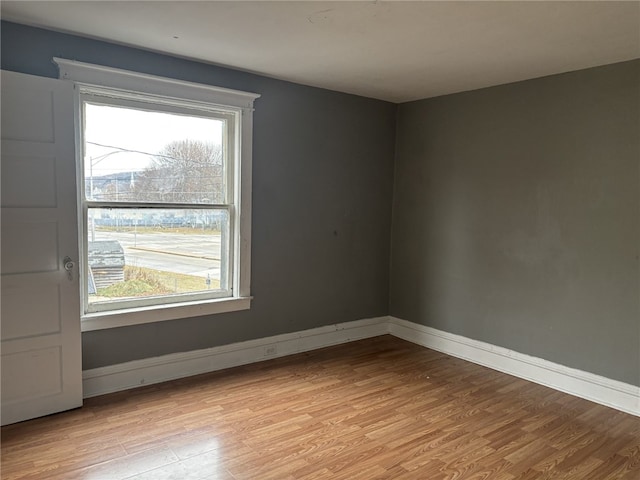 spare room featuring light wood-type flooring