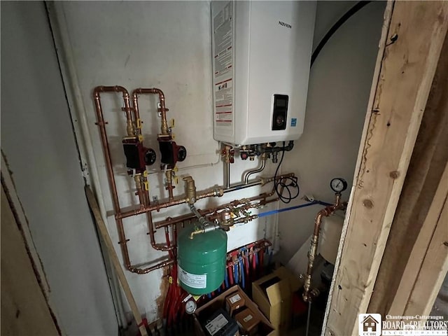 utility room featuring water heater