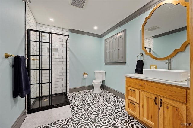 bathroom featuring tile patterned floors, walk in shower, vanity, crown molding, and toilet