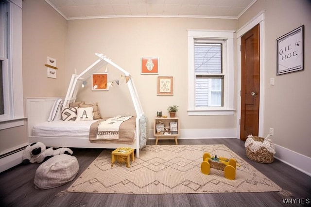 bedroom featuring hardwood / wood-style flooring and ornamental molding