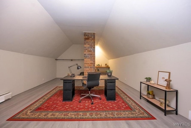 office area with hardwood / wood-style floors and lofted ceiling