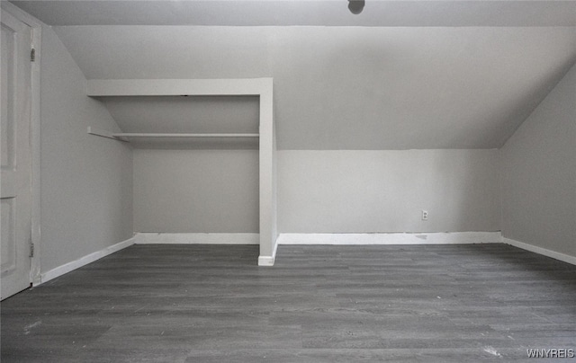 bonus room featuring dark hardwood / wood-style flooring and lofted ceiling