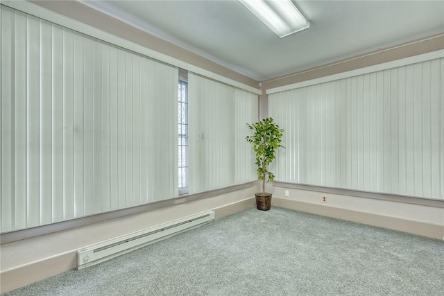 unfurnished room with carpet flooring and a baseboard radiator